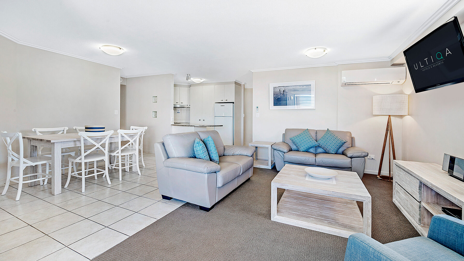 Open-plan living and dining area in 3 Bedroom Dual Key Apartment at ULTIQA Shearwater Resort.