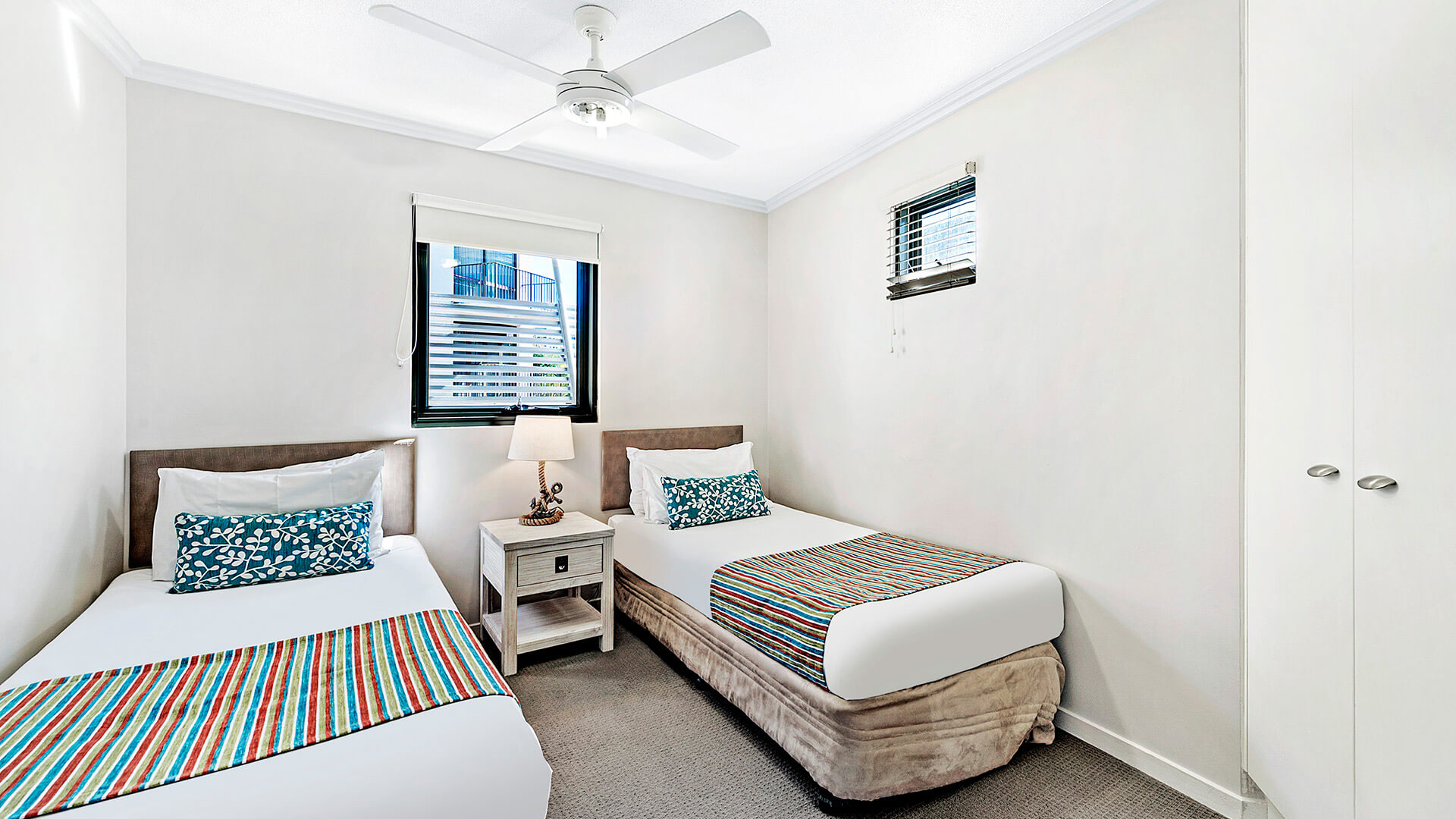 Second bedroom with two single beds in 3 Bedroom Dual Key Apartment at ULTIQA Shearwater Resort.