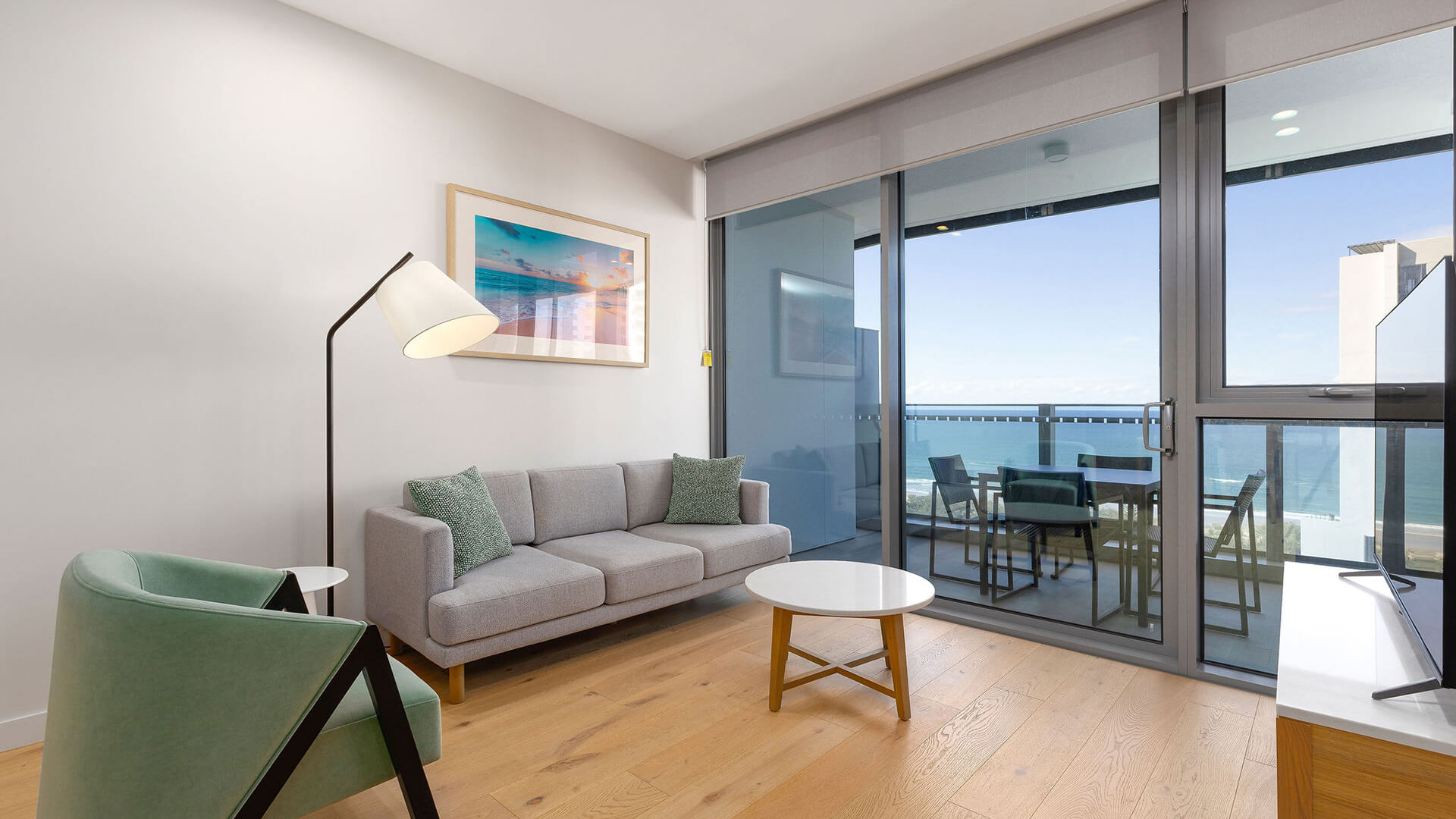 Living area with ocean views in 1 Bedroom Ocean View Suite at ULTIQA Signature at Broadbeach.