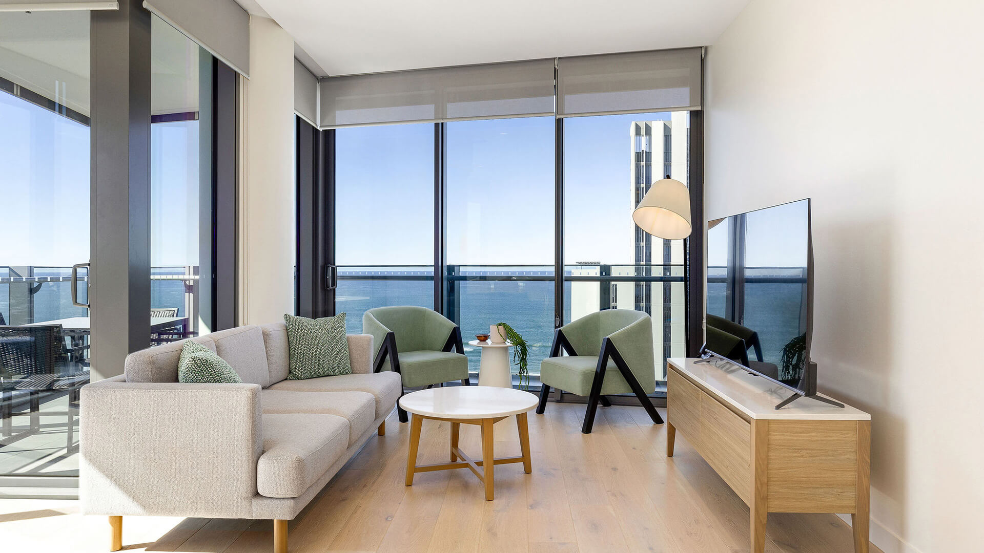 Living area with ocean views in 2 Bedroom Ocean View Suite Premium at ULTIQA Signature at Broadbeach.