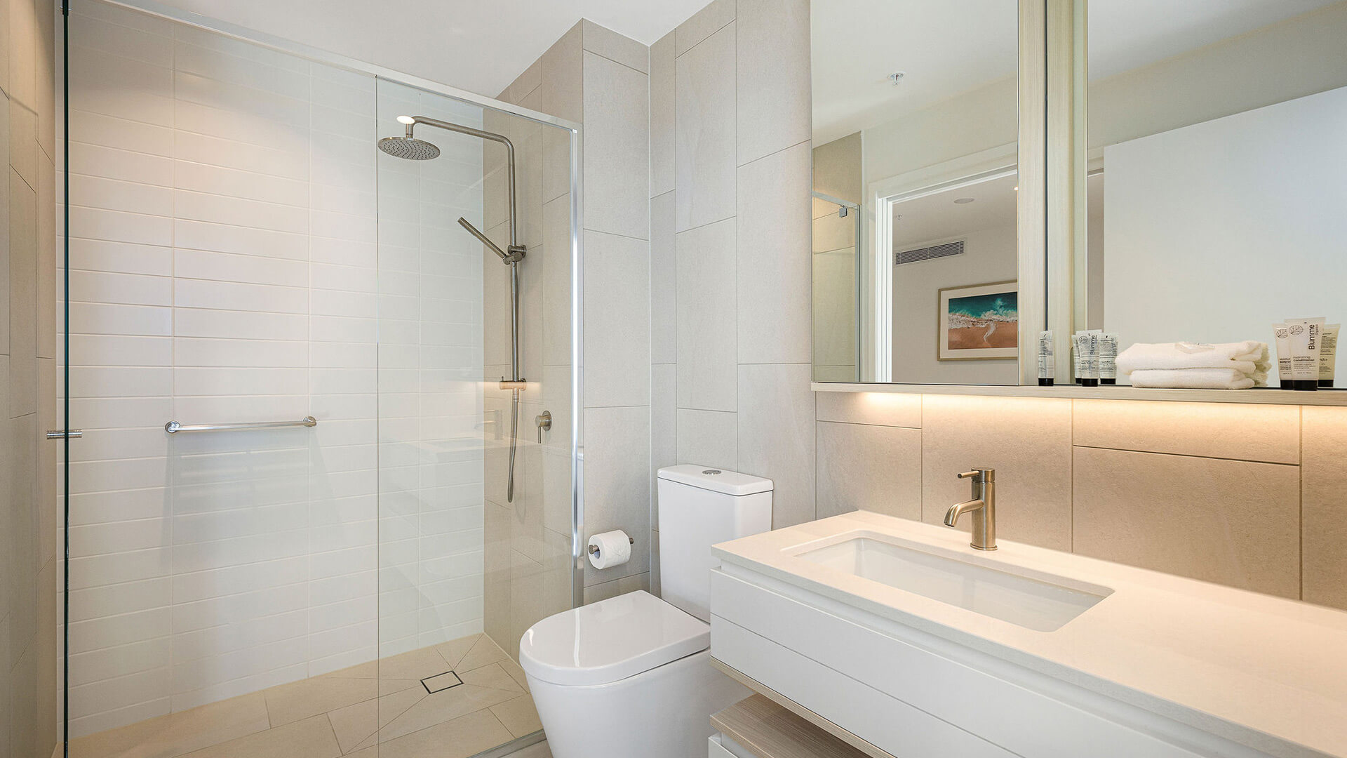 Modern bathroom with walk-in shower in 2 Bedroom Ocean View Suite Premium at ULTIQA Signature at Broadbeach.
