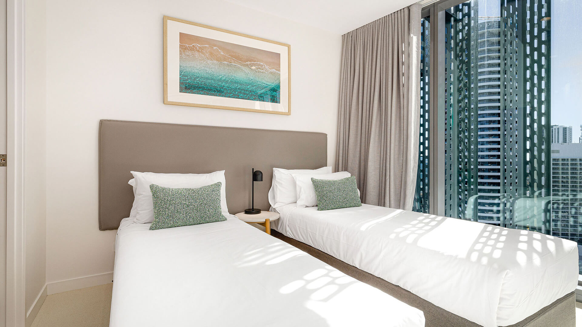 Second bedroom with twin beds in 2 Bedroom Ocean View Suite Premium at ULTIQA Signature at Broadbeach.