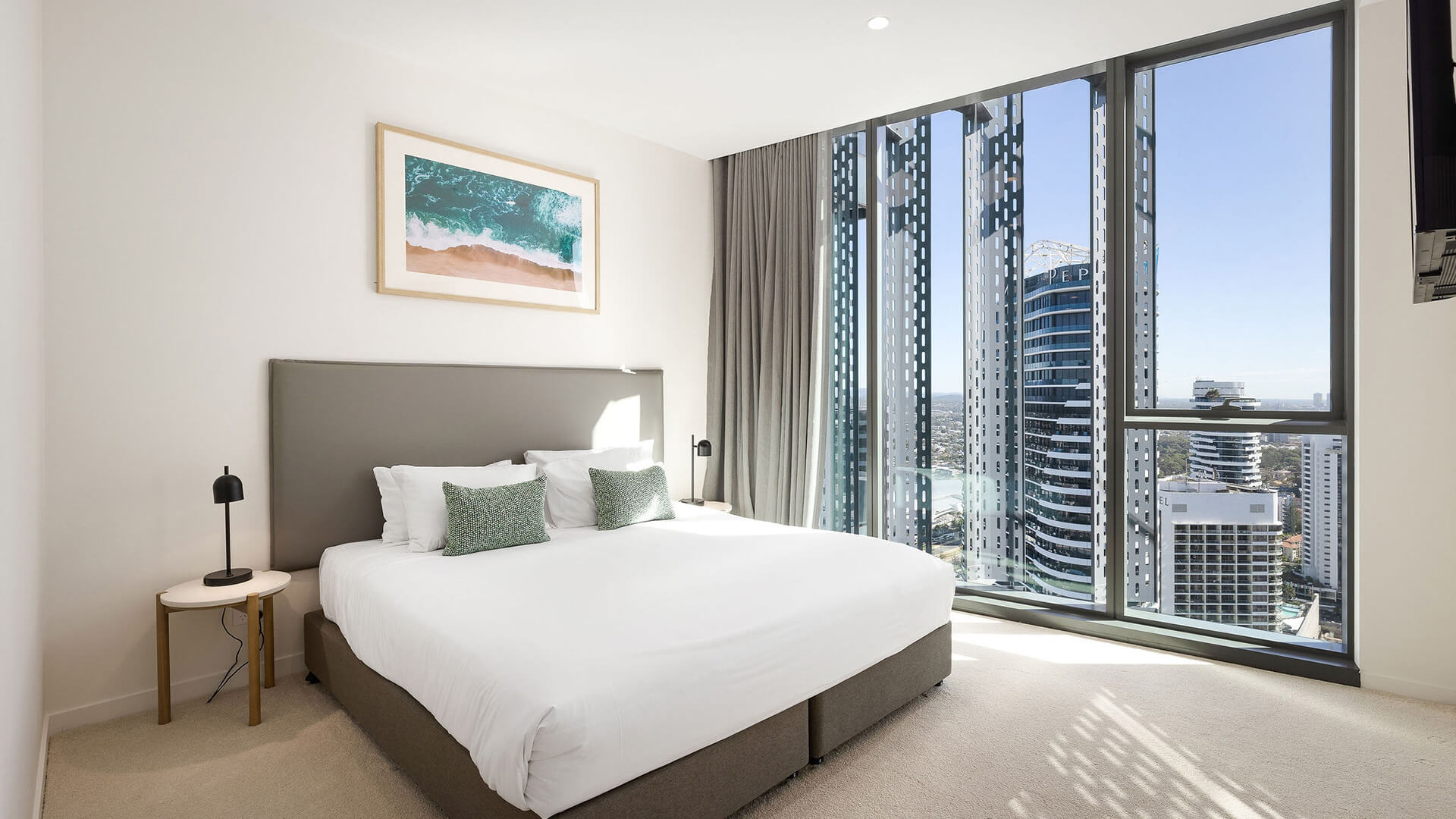 Bedroom in 3 Bedroom Ocean View Suite at ULTIQA Signature at Broadbeach with city views.