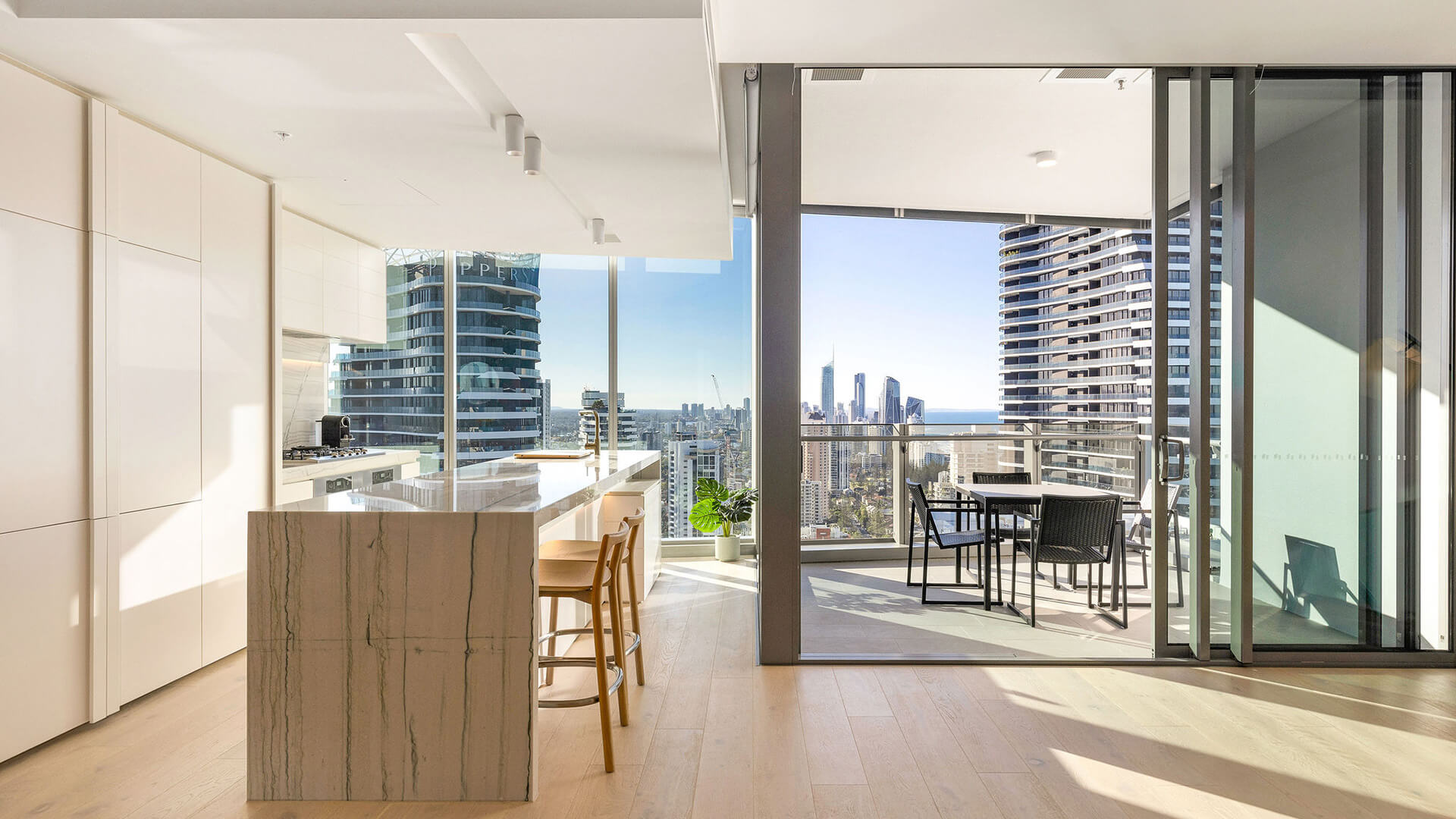 Kitchen in 3 Bedroom Ocean View Suite at ULTIQA Signature at Broadbeach with balcony views.